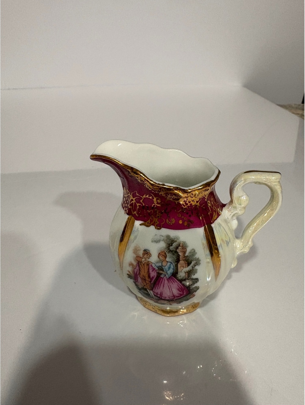 Vintage Porcelain Miniature Pitcher with Romantic Scene and Gold Trim